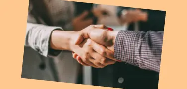 Two people shaking hands.