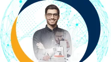 Person smiling and working with a microscope, blue and orange circles in background.
