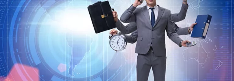Person in a suit multitasking with various office items in hand.