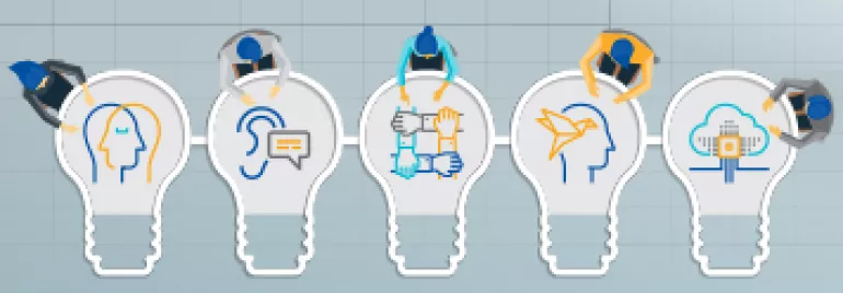 Ampoules illustrant des concepts de travail d'équipe et de technologie sur un fond quadrillé.
