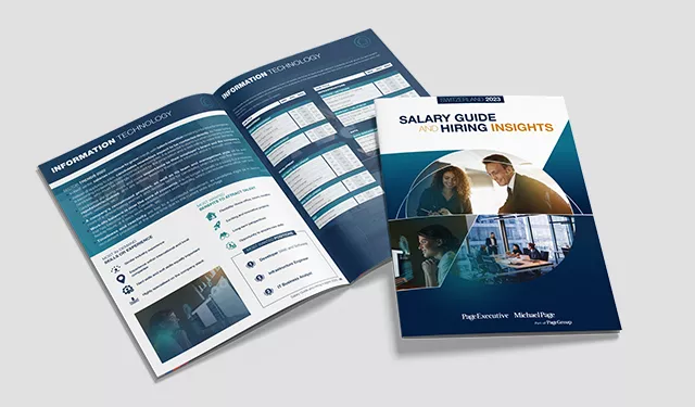 Cover of salary guide and hiring insights booklet, open to information technology pages.