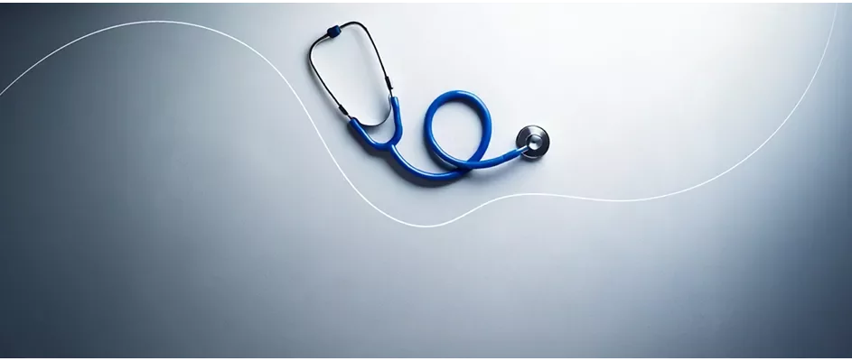 A stethoscope in a blue gradient background