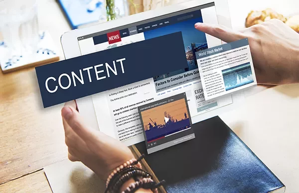 Tablet displaying news and stock market updates with content overlay.